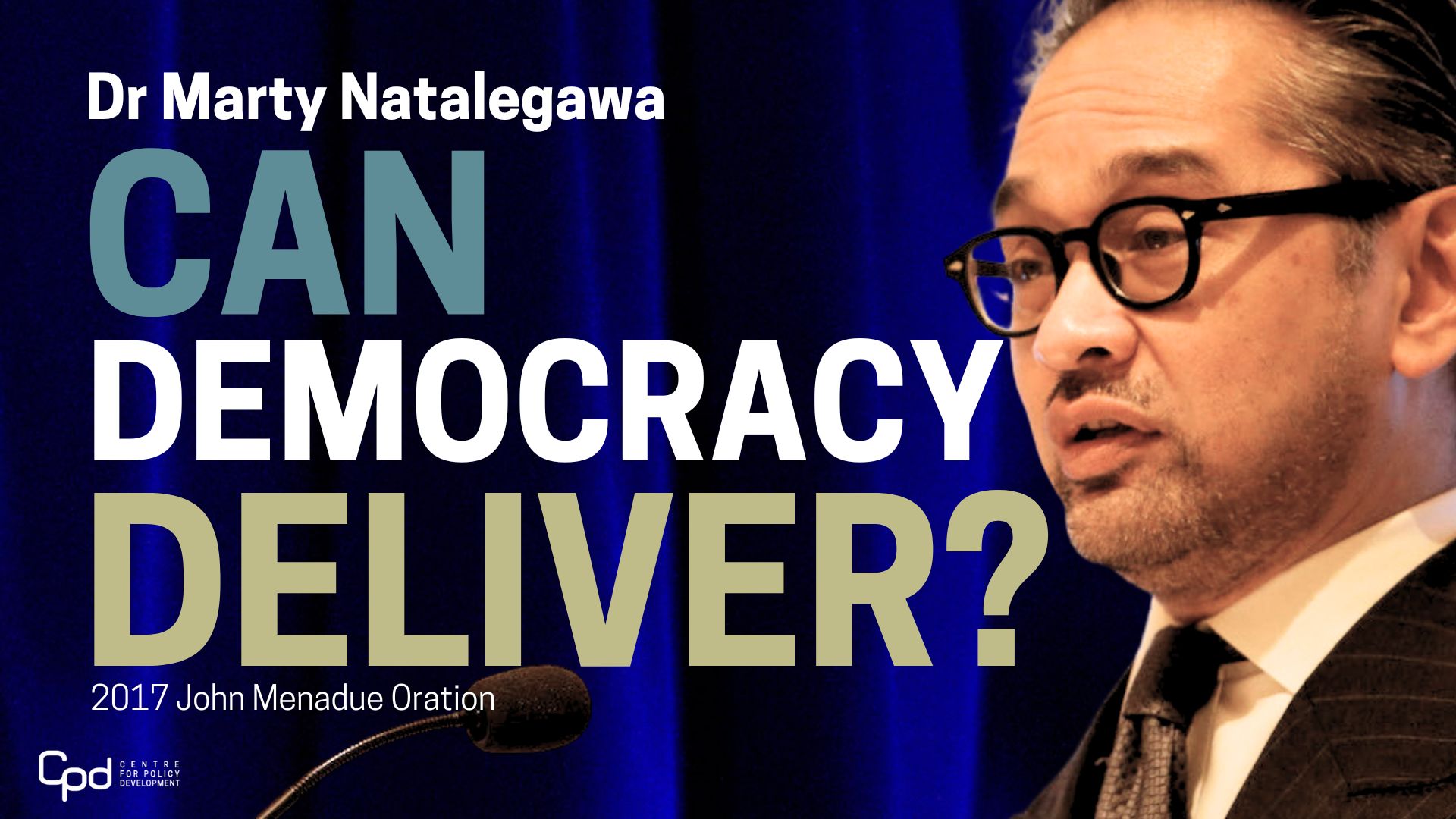 Dr Marty natalegawa 2017 John Menadue Oration Can Democracy Deliver Tile Image. A speaking into a mic next to the words Can Democracy Deliver